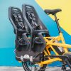 image showing that 2 yepp maxi child capsules and the Tern cargo hold pannier bags all fit